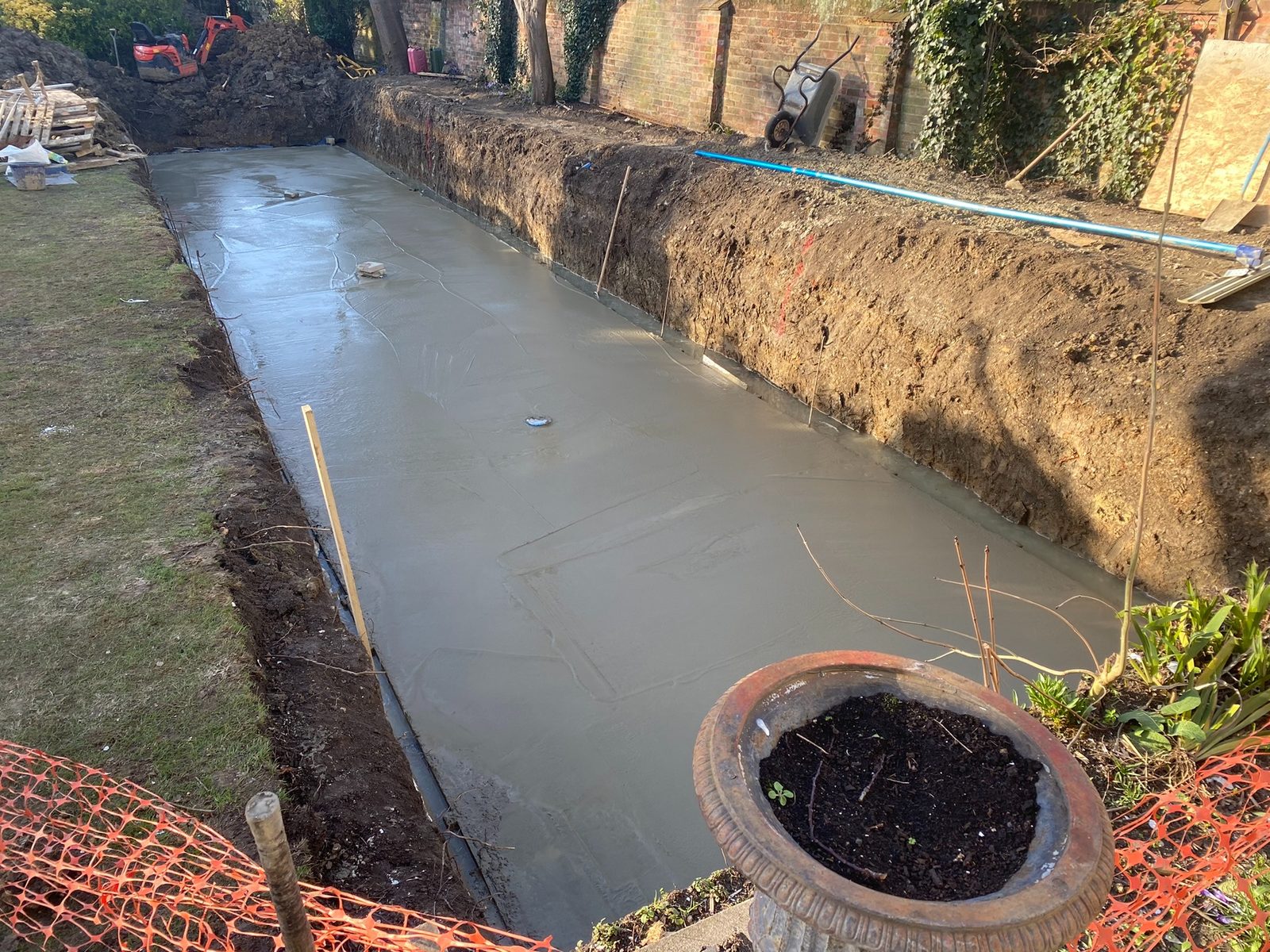 Fresh concrete base poured for swimming pool