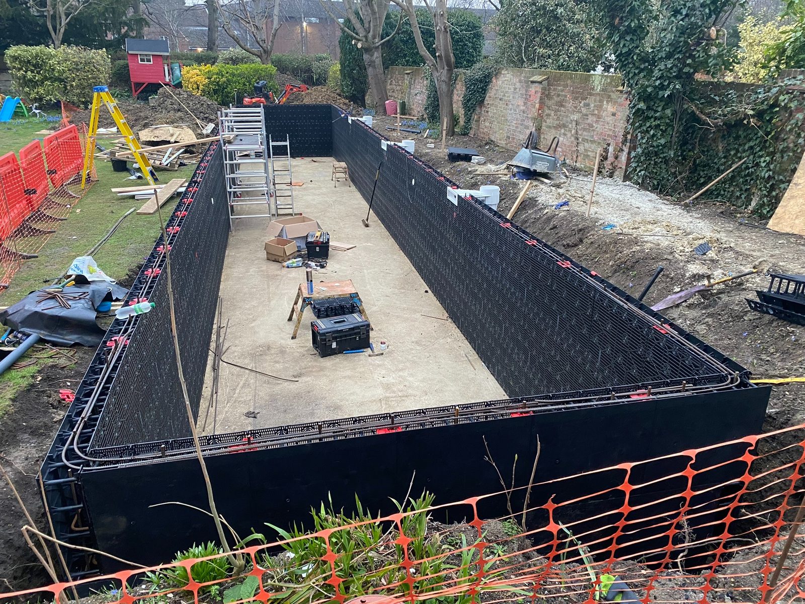 Close detail of swimming pool wall construction system